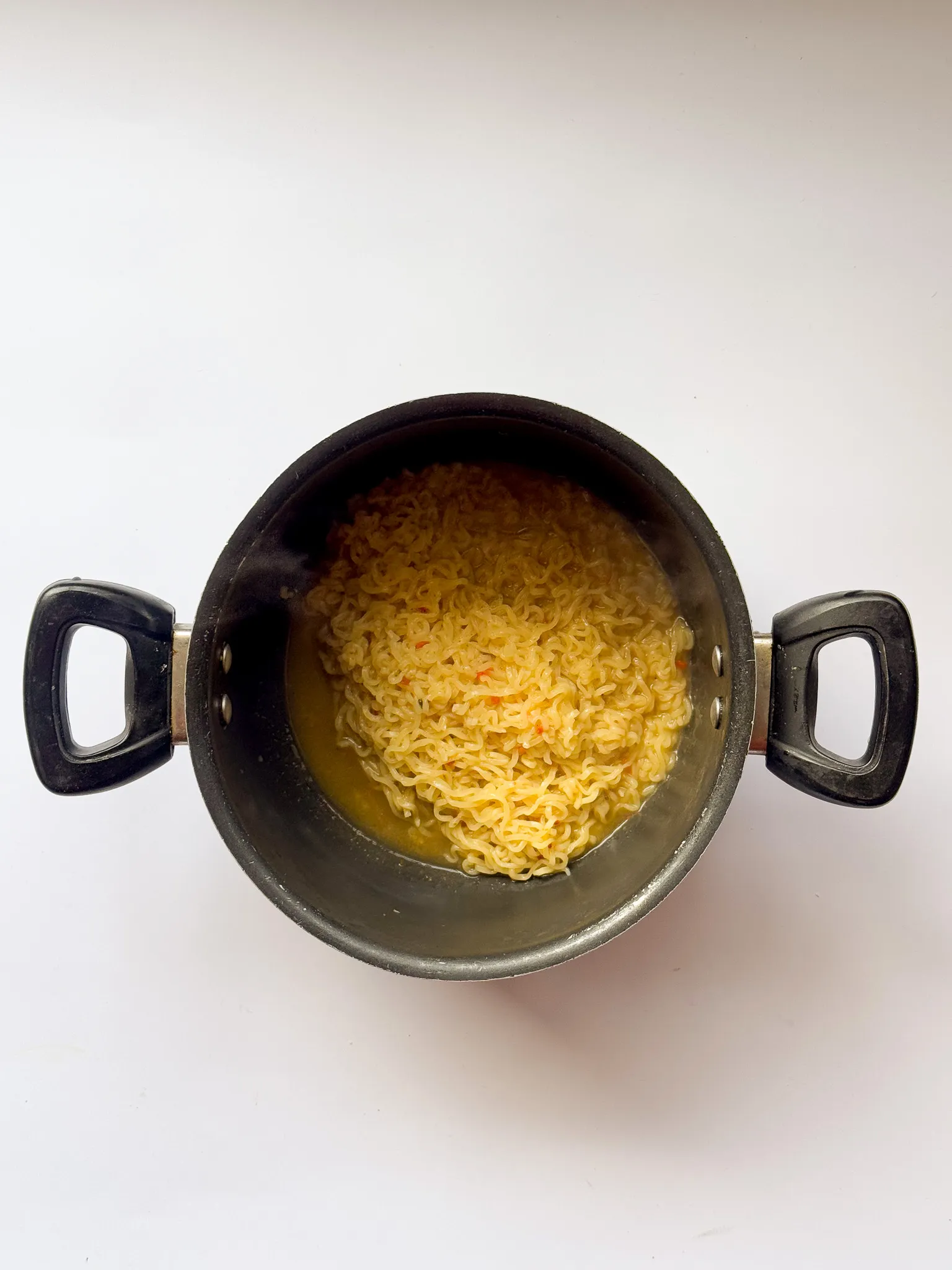 Boiling the noodles.