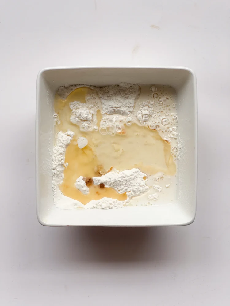 Wet ingredients poured on to dry mix.