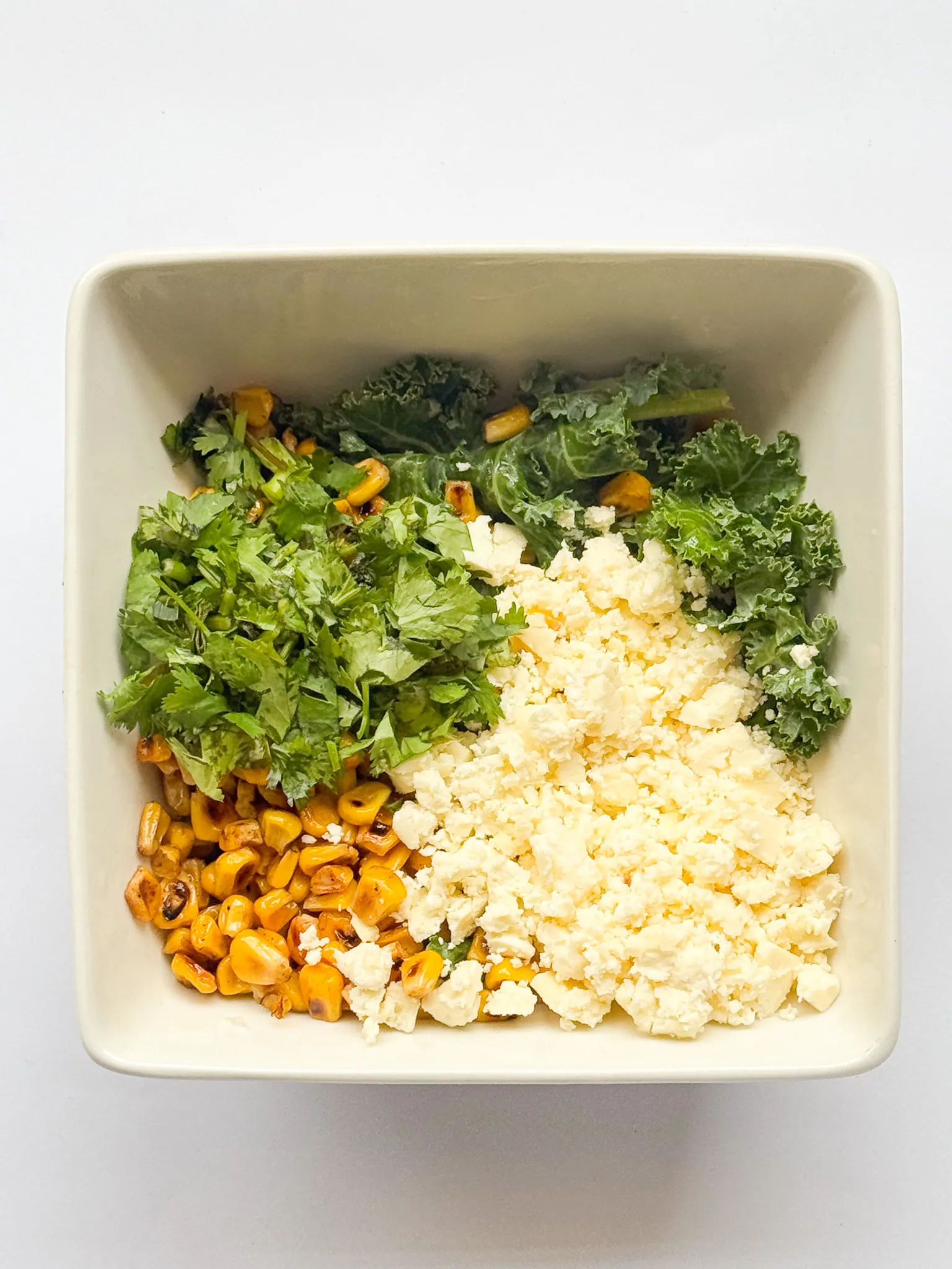 Green, cheese, and corn mixed.