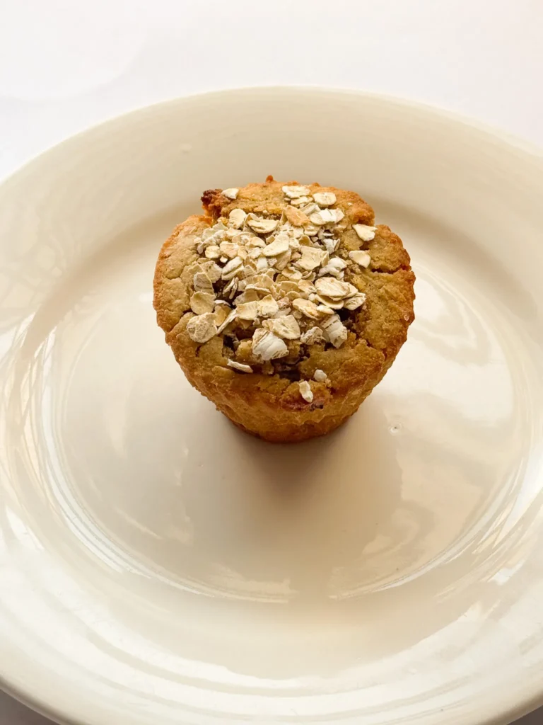 One muffin topped with rolled oats.
