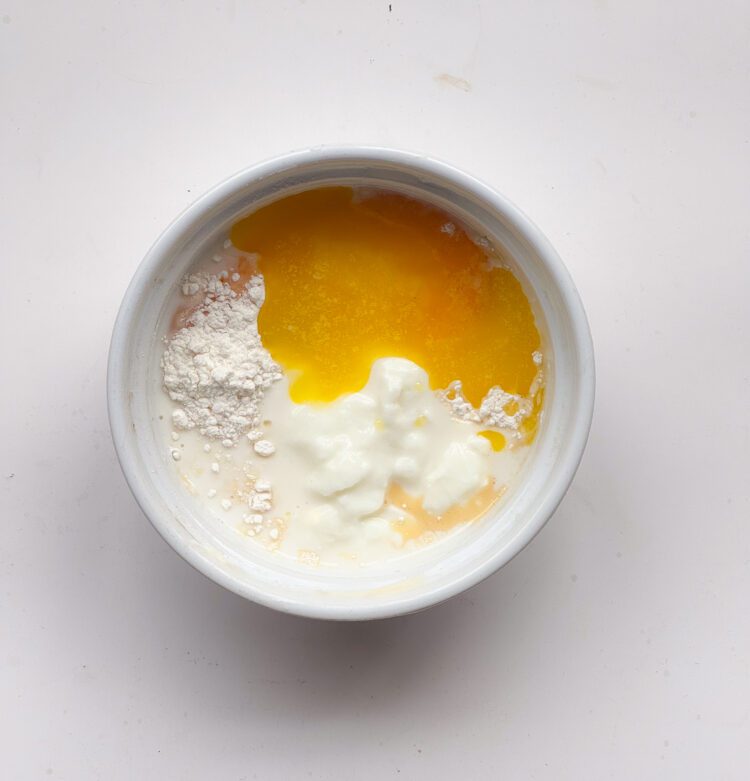 Mixing the dry ingredients with wet ingredients.