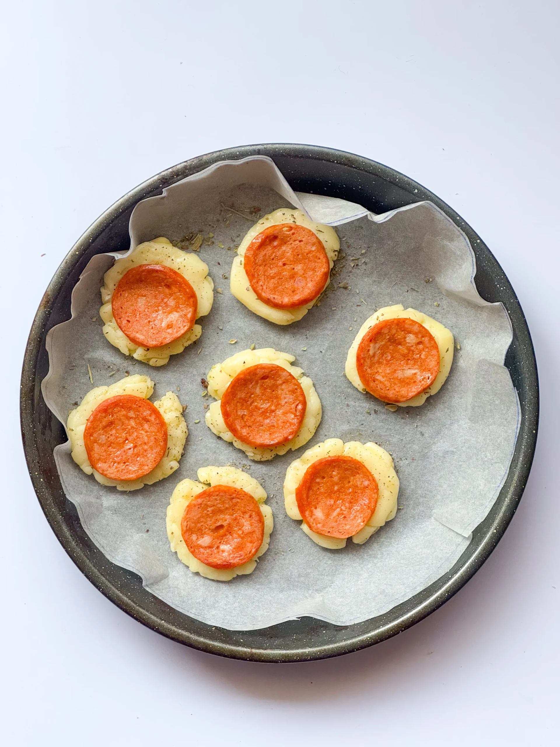 chips ready to be baked, lined on the parchment sheet.