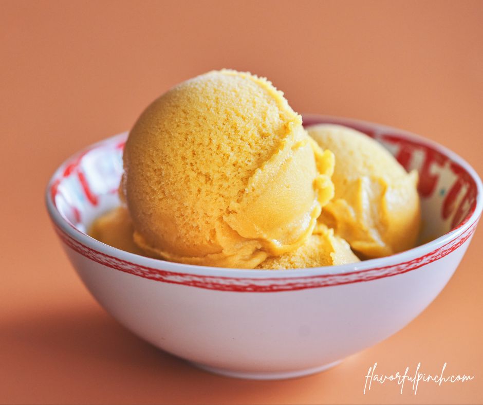 2 scoops of coconut cottage cheese ice cream in a bowl