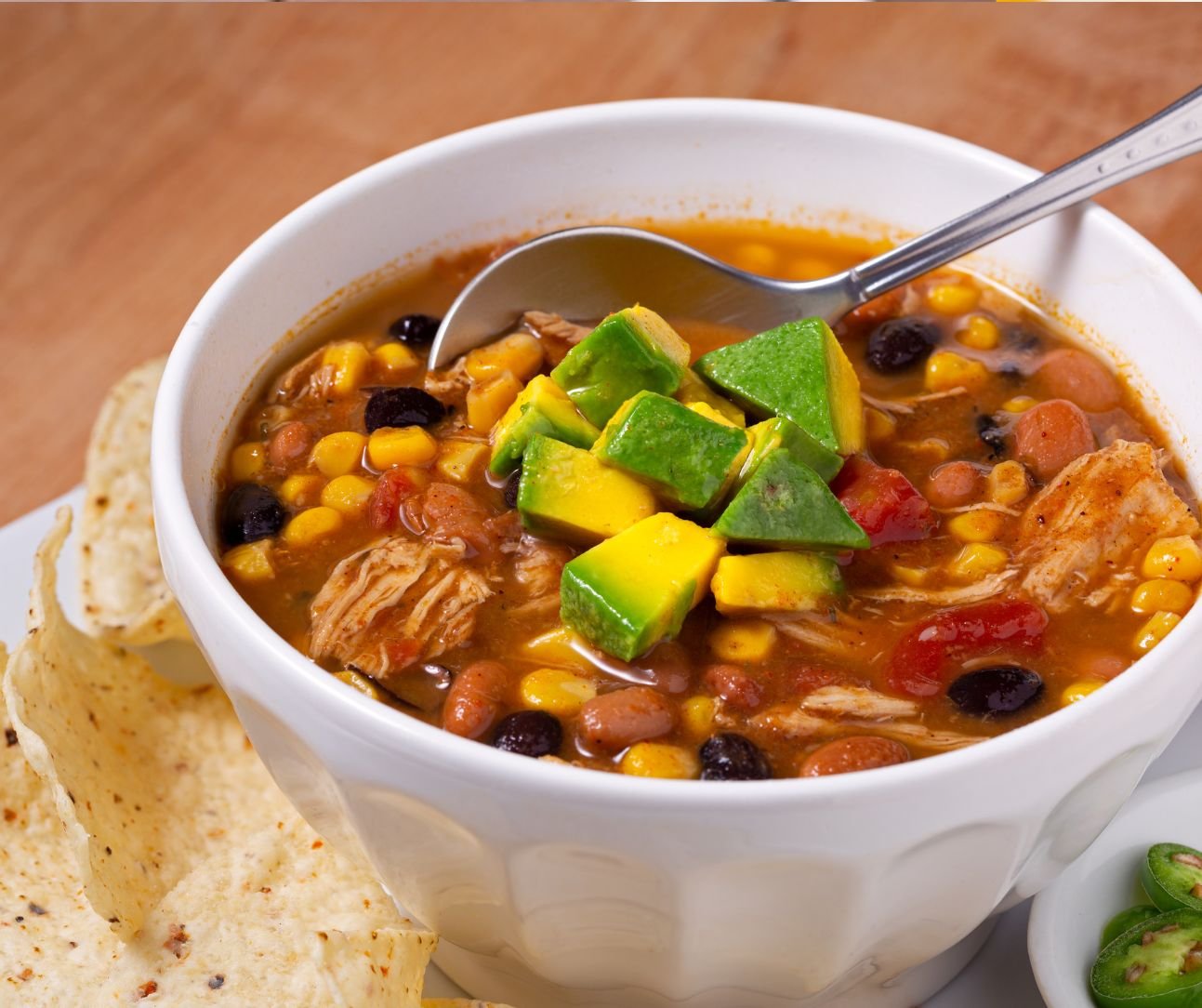Slow cooker chicken taco soup in a bowl with toppings