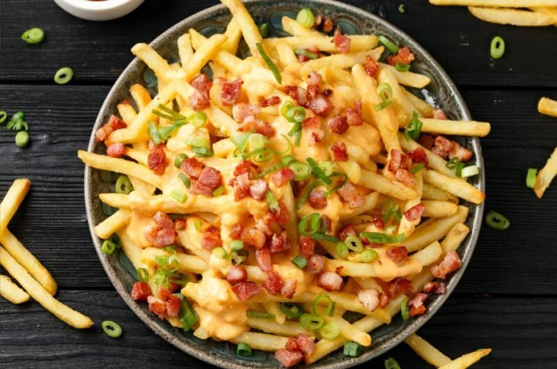 Crispy French Fries Loaded with Bacon, Cheese Sauce and Spring Onion