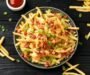 Crispy French Fries Loaded with Bacon, Cheese Sauce and Spring Onion