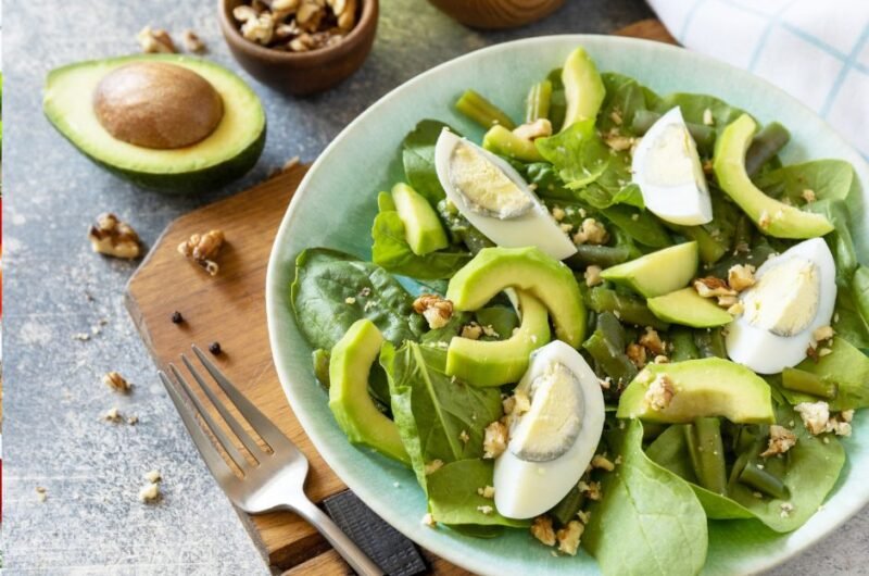 Organic Green Avocado and Spinach Salad with Boiled Eggs, Green Beans and Walnuts
