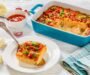 Riced Cauliflower Breakfast Casserole with Melted Cheese, Crispy Bacon and Green Onion