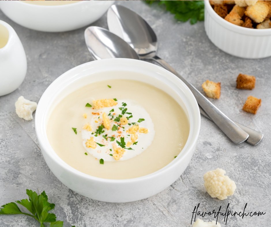 Cauliflower soup with cheese, cream, and fresh parsley