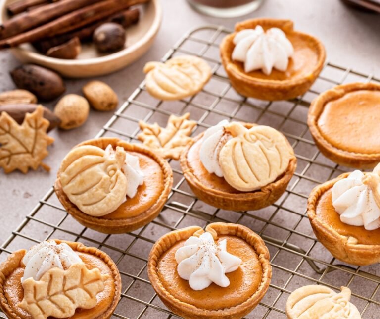 Mini Pumpkin Pies with Whipped Cream and Cinnamon