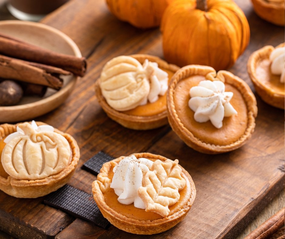 Mini Pumpkin Pies with Whipped Cream and Cinnamon