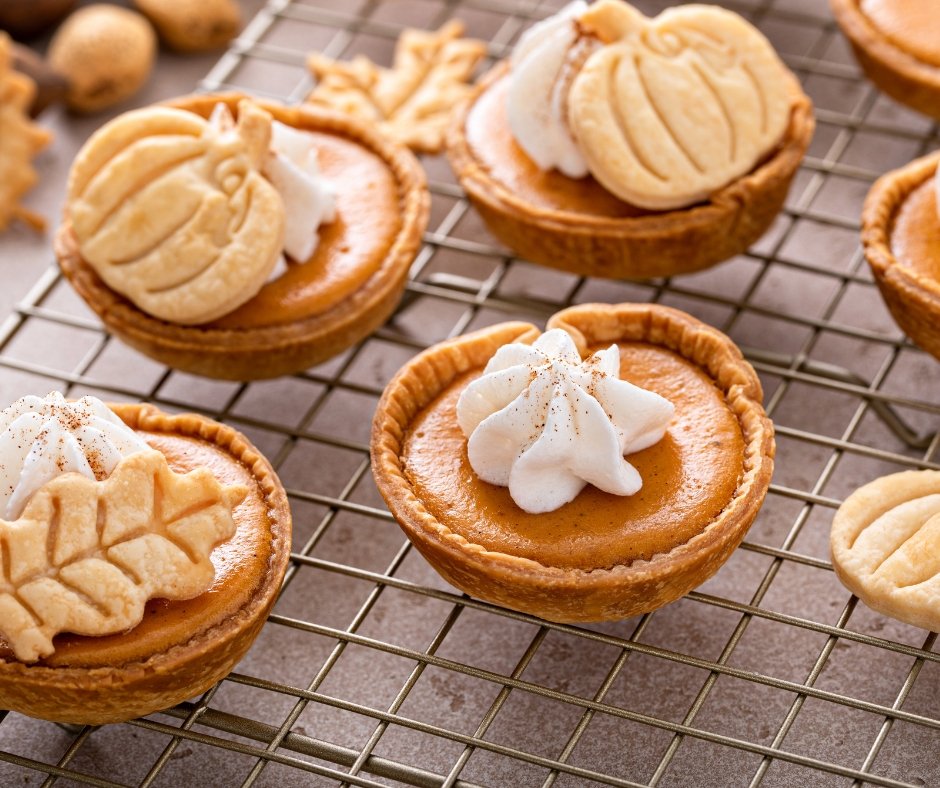 Mini Pumpkin Pies with Whipped Cream and Cinnamon