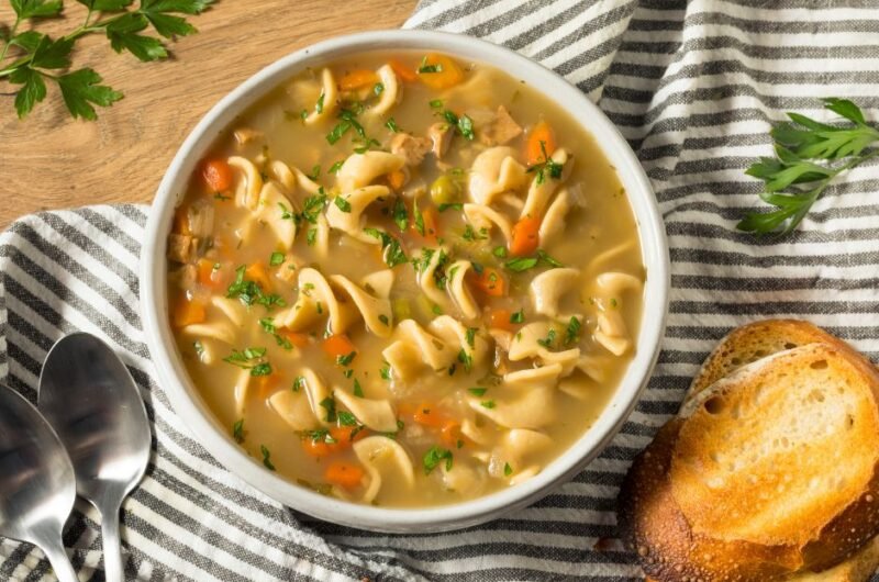 Homemade Chicken Noodle Soup with Peas and Carrots